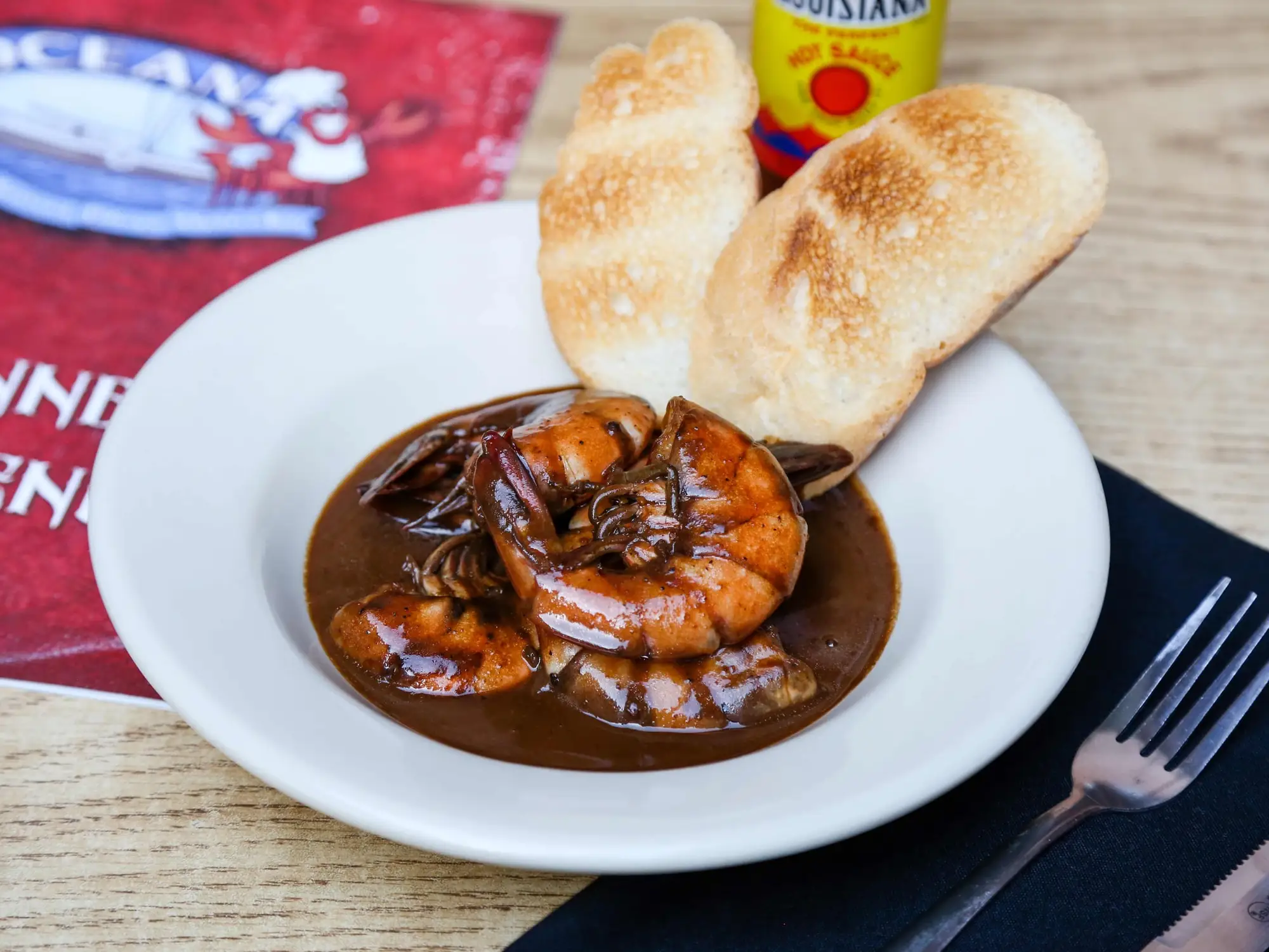 New Orleans barbecued shrimp in a peppery butter sauce with French bread