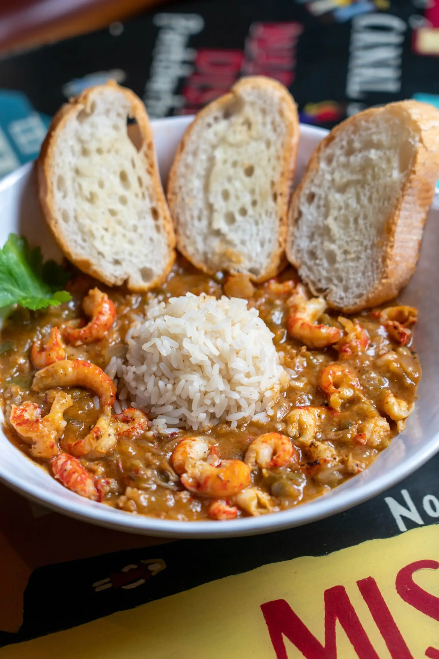 Crawfish étouffée over white rice with toasted French bread