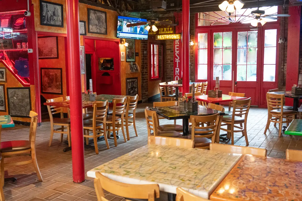 Red columns and neon signs in Oceana Grill’s Cookery Dining Room