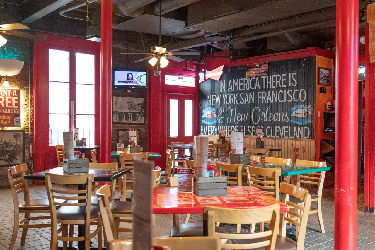 Oceana Grill’s Cookery Dining Room: red French doors, ceiling fans and painted tables