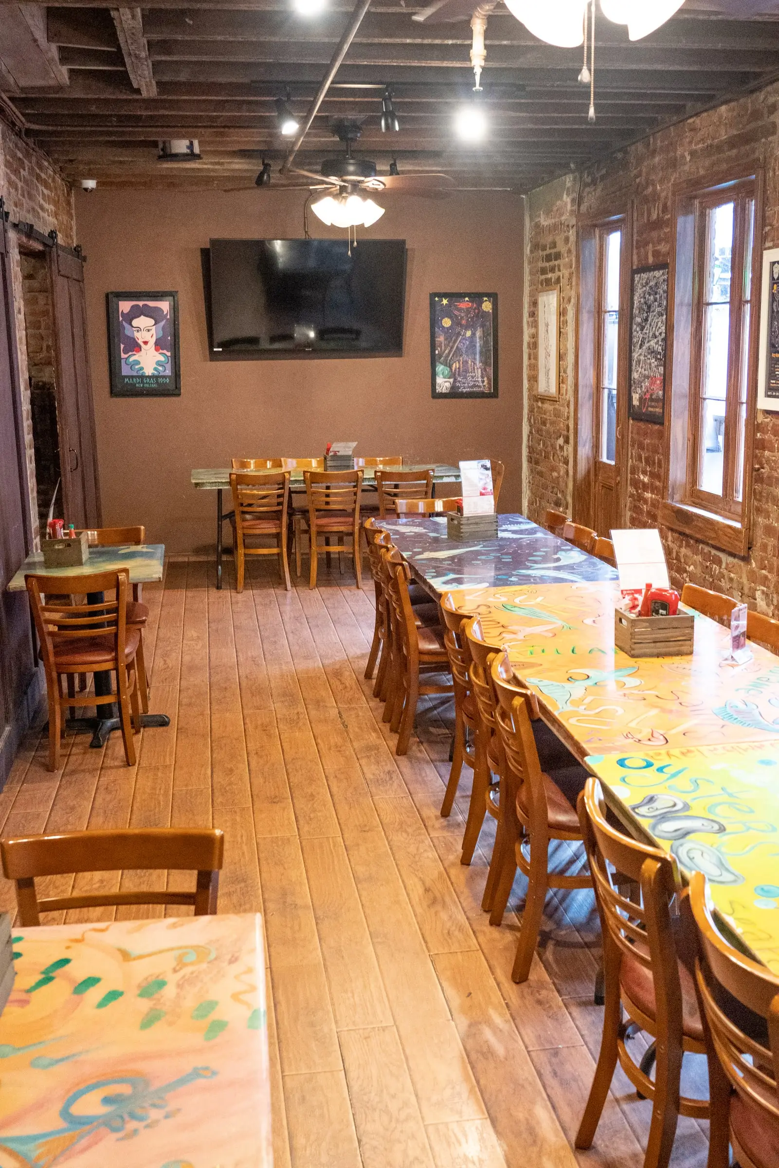 Tables and tall windows in the LaFourche Room