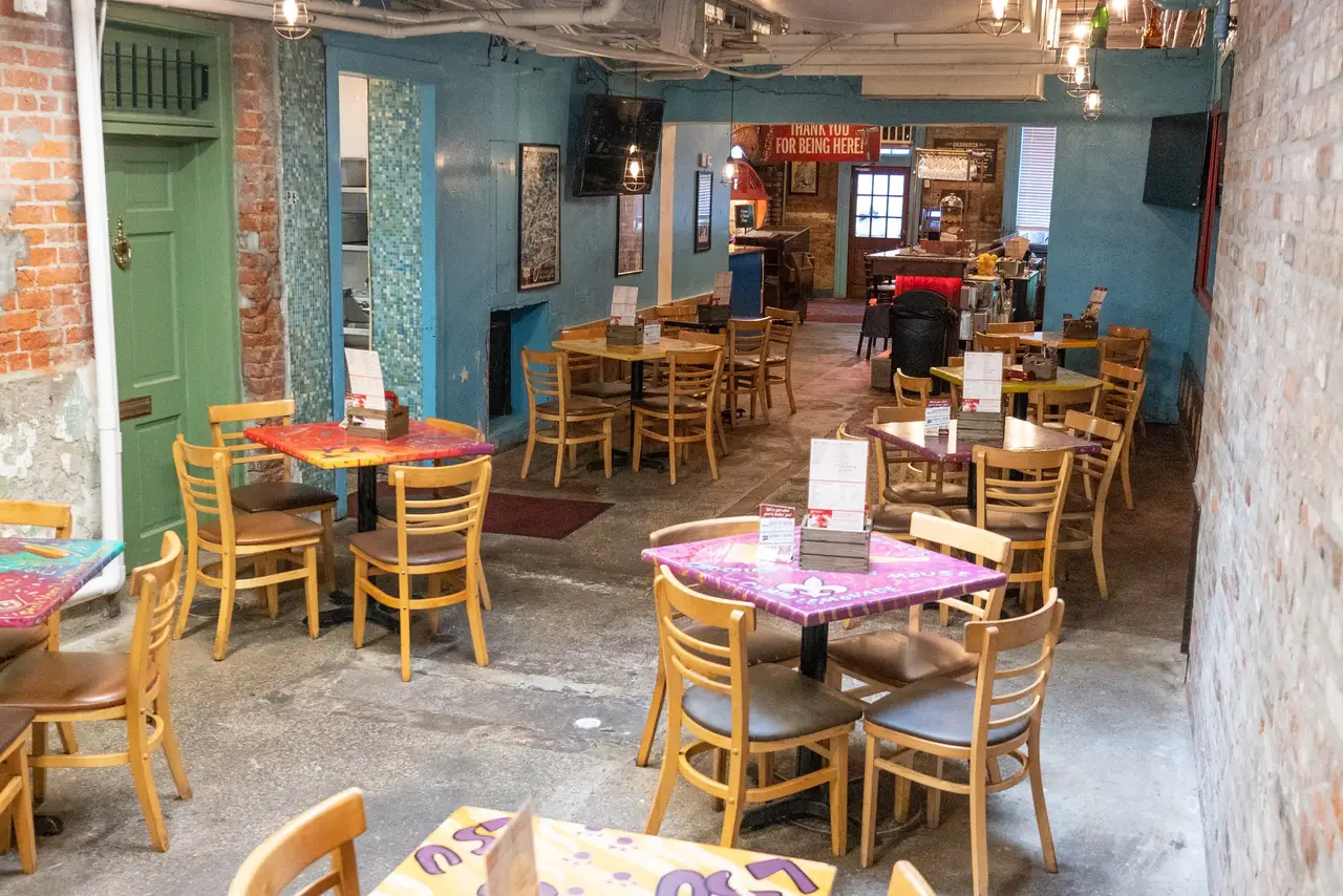 Oceana Grill’s main dining room: turquoise and orange walls, exposed brick and colorful tables