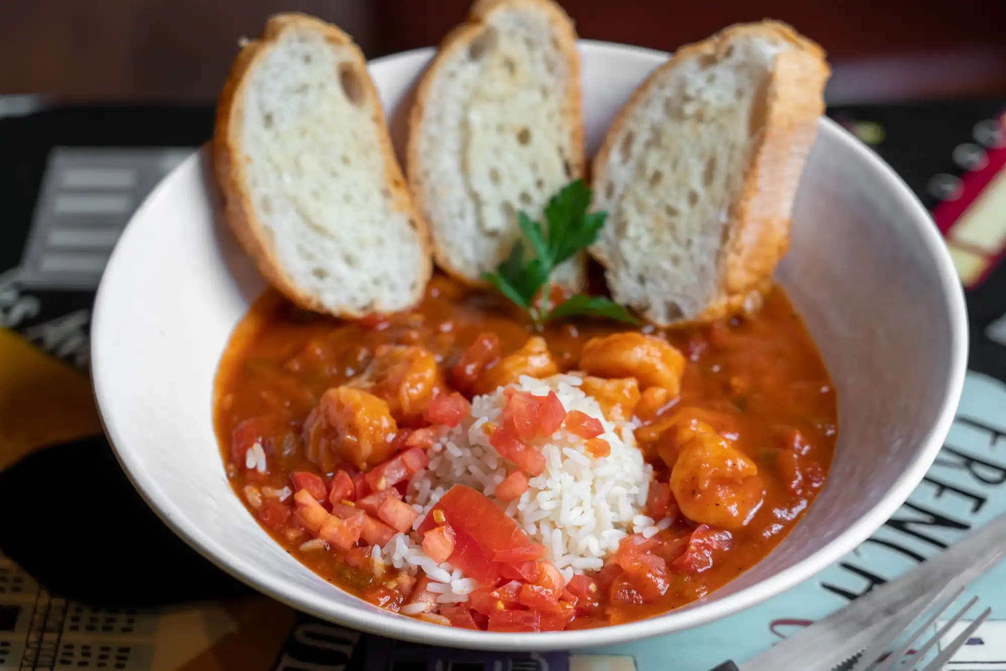 Shrimp Creole over white rice with toasted French bread