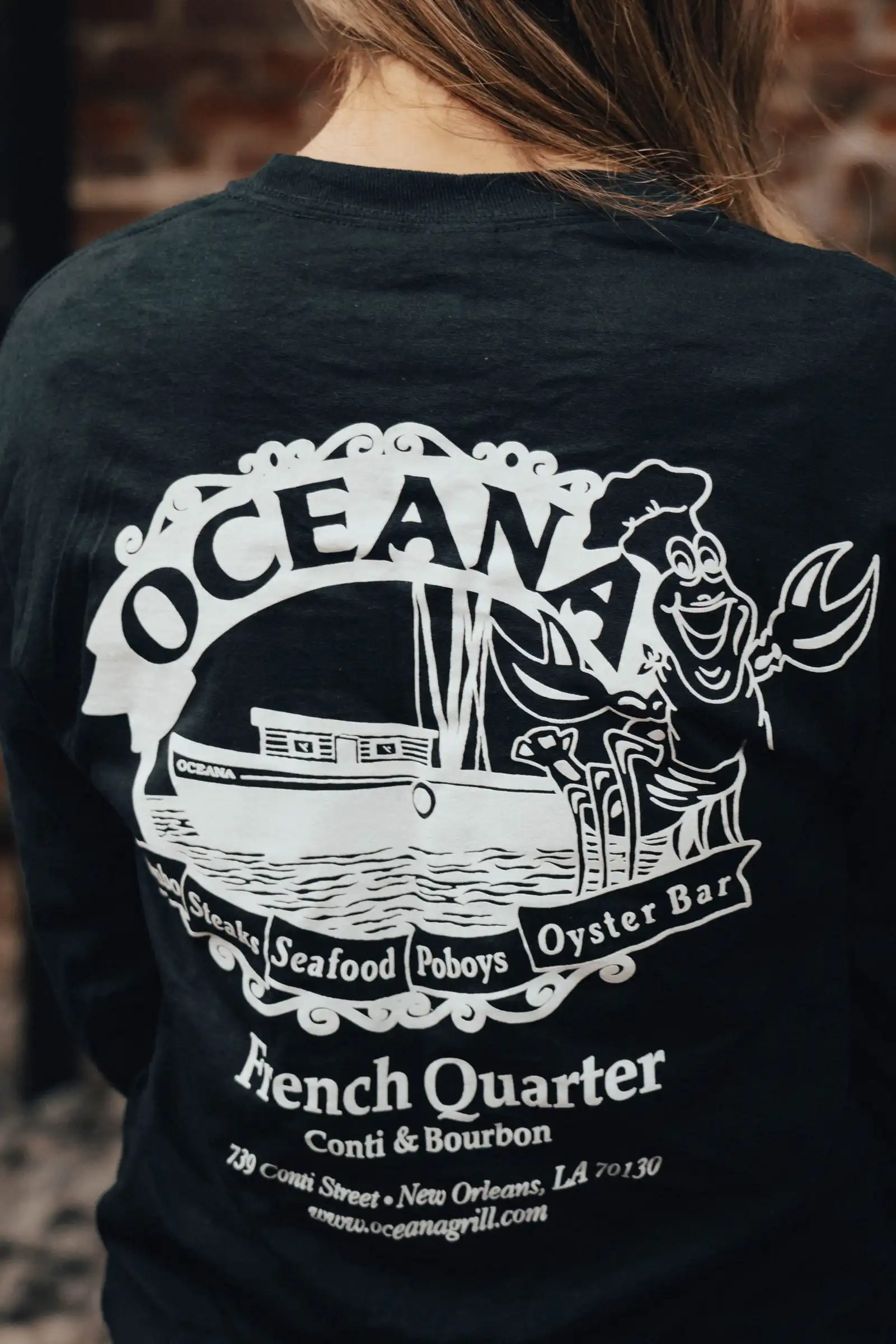 Back print of the Oceana T-shirt: the logo with “French Quarter, Conti & Bourbon”